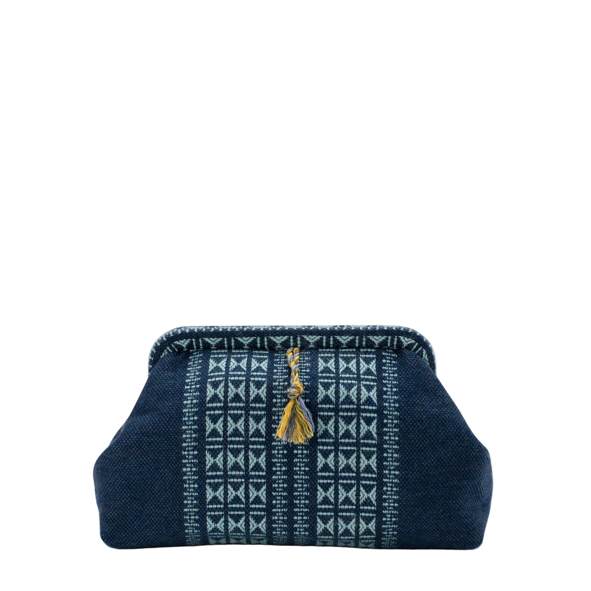 Navy blue handbag with white pattern and gold tassel on a white background