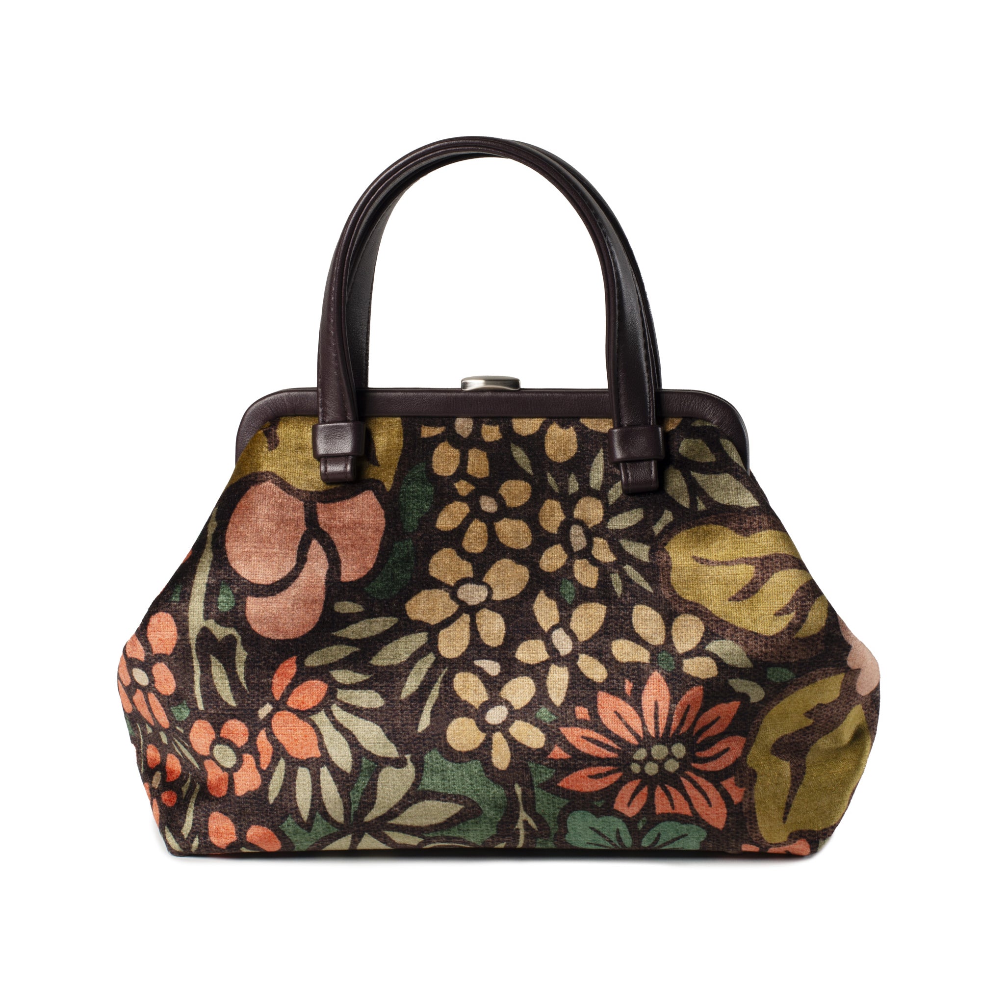 A vintage-style handbag with a dark brown leather handle and frame, featuring a dense floral tapestry pattern in olive green, mustard yellow, terracotta orange, and beige on a black background.